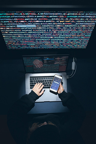 A defense expert working at a computer.